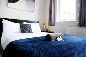 COMFORTABLE 4-Bed HOME WITH 3 BATHROOMS AND FREE PARKING!